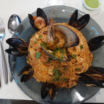 Shark’s Peruvian Cuisine - Seafood rice with mussels - Latin American Near Me - Central Falls, Rhode Island Shark’s Peruvian Cuisine - Seafood rice with mussels - Latin American Near Me - Central Falls, Rhode Island