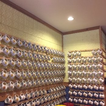 Falling Rock Cafe and Book Store - Coffee mug club wall - Bookstores Near Me - Munising, Michigan