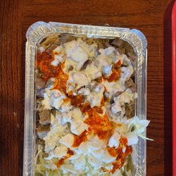 Shah’s Halal - Lamb over rice with lettuce, onion, white, and hot sauce