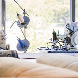 Ayoub N&H® Carpet - Large windows allow natural light into the repair department so our team can choose the best colors of yarn, binding, etc.