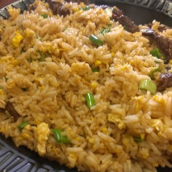 Lola's Chicken - don't let the photo fool you there was tons of tender sliced skirt steak under the rice. - Peruvian Near Me - Van Nuys, California Lola's Chicken - don't let the photo fool you there was tons of tender sliced skirt steak under the rice. - Peruvian Near Me - Van Nuys, California