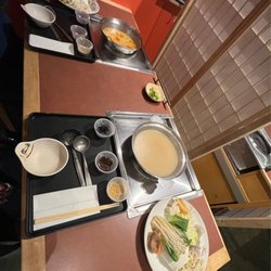 Happy Shabu Shabu - Spicy tonkatsu and regular tonkatsu broths were great. Ponzu, spicy, and sesame sauces