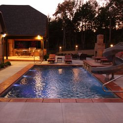 Gunite pool with fountain and waterslide.