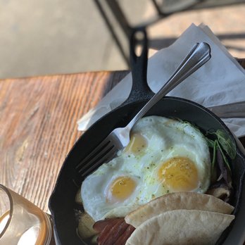 The Common - 3 Poached Eggs Skillet in Tomato, Onion, and Pepper Stew Skillet - Breakfast & Brunch Near Me - Brooklyn, New York The Common - 3 Poached Eggs Skillet in Tomato, Onion, and Pepper Stew Skillet - Breakfast & Brunch Near Me - Brooklyn, New York