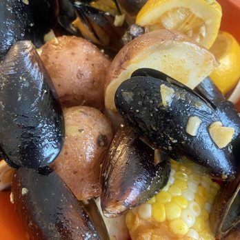 Happy Crab - Mussles and clams with potatoes and corn. I got the Cajun sauce medium spicy. - Seafood Near Me - Somerville, Massachusetts