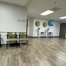 Quest Diagnostics - Waiting room - large - spaced out chairs with 3 check in machines