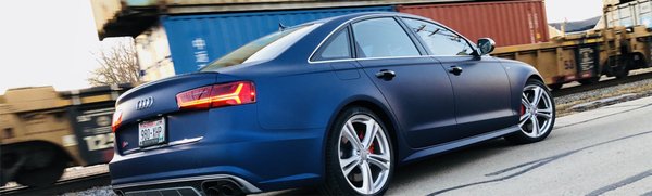 Audi Full WRAP - This wrap was applied shortly after the customer purchased the vehicle.  The wrap not only will set the clients vehicle apart from the basic Black, silver and white Audi's in the lot, it will also protect the paint and when the customer trades this in it will look brand new under it.