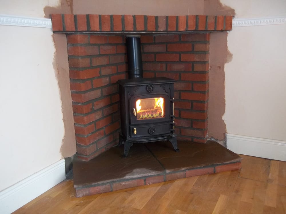 Small Corner Brick Fireplace With Log Burning Stove Yelp