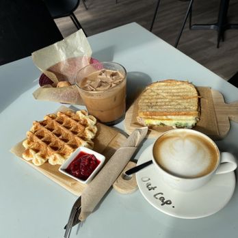 Espresso Cafeto - Waffle with fresh jam, egg and spinach sando, oat cappuccino and dirty Colombian - Coffee & Tea Near Me - Larchmont, New York