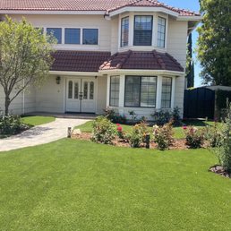 Front yard rose garden, artificial turf and new pathway. Front yard rose garden, artificial turf and new pathway.