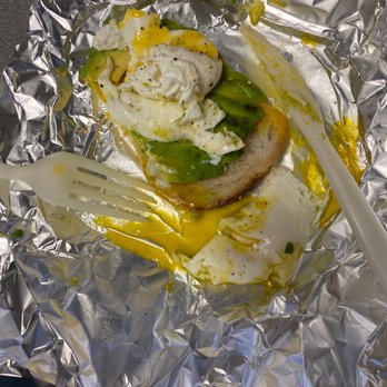 Get Fresh Cafe - Avocado Toast with Poached Egg (partially eaten because I could not wait) - Cafes Near Me - Iowa City, Iowa