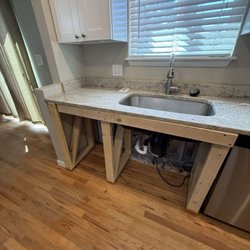 Renew Medic - Plumbing remains intact and kitchen functional during the cabinet repair process.