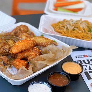 Photo of Fire Wings - Cupertino, CA, United States. 20 pc Wings: Jamaican Jerk, Peanut Butter, Dragon ($22.99), Large Garlic Noodles ($6.29), Veggie Sticks ($2.29)