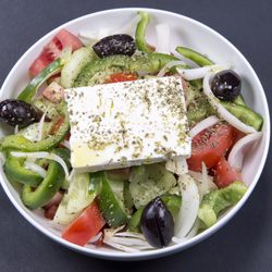 Taste of Greece - Greek salad, freshly sliced tomato, onion, capsicum, olives, feta cheese seasoned with oregano and dressed with lemon and olive oil.