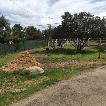 M&C Weed Abatement - a pile of mulch in the foreground - Landscaping Near Me - Jamul, California M&C Weed Abatement - a pile of mulch in the foreground - Landscaping Near Me - Jamul, California