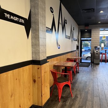 The Angry Jerk - tables and chairs in a restaurant - Caribbean Near Me - Silver Spring, Maryland