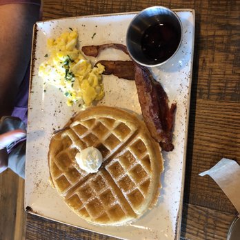 First Watch - Trifecta with waffle and bacon. (Not extra crispy and a little odd shape to the waffle) - Breakfast & Brunch Near Me - Kettering, Ohio