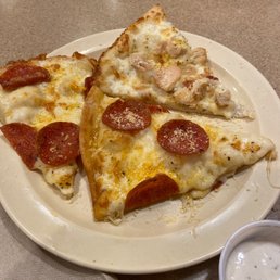 White cheese pepperoni pizza and a Lemon pepper chicken pizza White cheese pepperoni pizza and a Lemon pepper chicken pizza