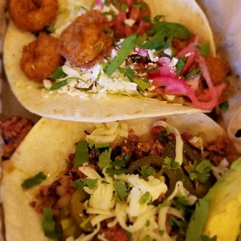 Torchy's Tacos - Baja shrimp and crossroads (smoked beef brisket, avocado, cilantro, onions, and tomatillo sauce) - Tex-Mex Near Me - Houston, Texas Torchy's Tacos - Baja shrimp and crossroads (smoked beef brisket, avocado, cilantro, onions, and tomatillo sauce) - Tex-Mex Near Me - Houston, Texas