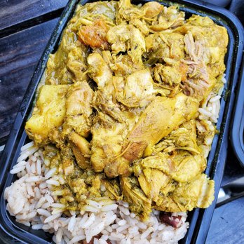 Roywoods - a meal of chicken and rice with a side of coleslaw - Caribbean Near Me - Toronto, Ontario