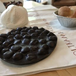 Hazelnuts with dark chocolate and meringue is bashfully hiding in the background Hazelnuts with dark chocolate and meringue is bashfully hiding in the background