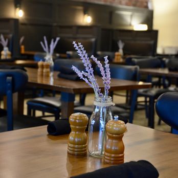 Seared Chophouse - a table with salt and pepper shakers - Steakhouses Near Me - Greenville, North Carolina Seared Chophouse - a table with salt and pepper shakers - Steakhouses Near Me - Greenville, North Carolina