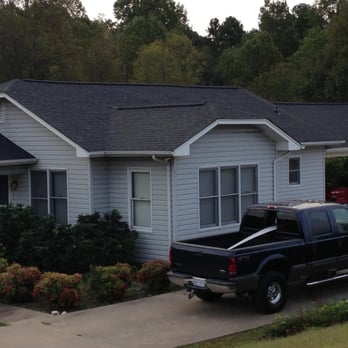 Philco Roofing and Remodeling - a truck parked in front of a house - Roofing Near Me - Mooresville, North Carolina Philco Roofing and Remodeling - a truck parked in front of a house - Roofing Near Me - Mooresville, North Carolina