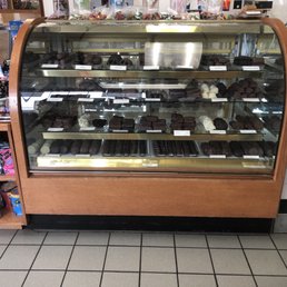 a display case with a variety of desserts