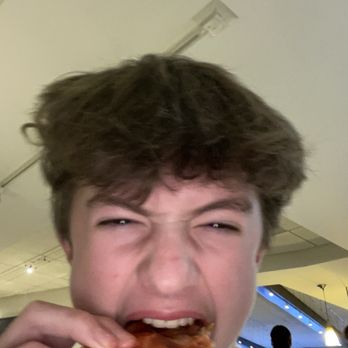 Trattoria D.O.C. - Me eating pizza - Italian Near Me - Evanston, Illinois