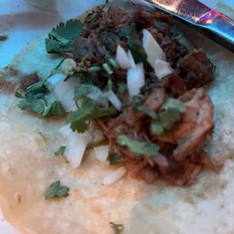 Carnitas taco, my personal favorite, my husband likes the carne asada tacos best