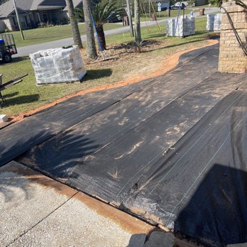 Bee Green Landscaping LLC - Prep work for a retaining wall black weed barrier cloth has been put down. - Lawn Services Near Me Bee Green Landscaping LLC - Prep work for a retaining wall black weed barrier cloth has been put down. - Lawn Services Near Me