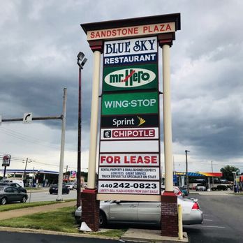 Wingstop - a large sign for a restaurant - Chicken Wings Near Me - Amherst, Ohio