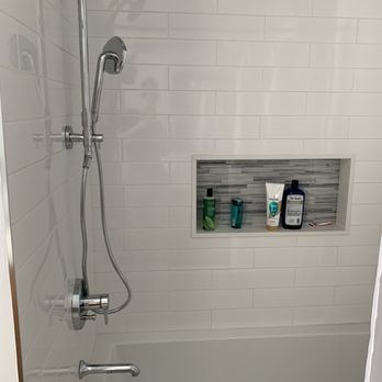 Atoz Construction - Awesome tile work and shower niche with accent tile. - General Contractors Near Me