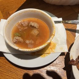 Albondigas soup half eaten, very good.