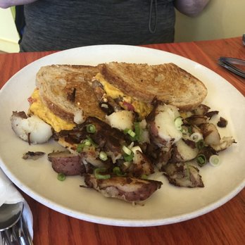 Simple Cafe - sandwich: egg, roasted peppers  caramelized onion, oven roasted tomatoes, baby spinach, mozzarella, tomato basil mayo on toasted sourdough - Breakfast & Brunch Near Me - Lake Geneva, Wisconsin