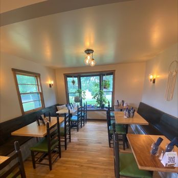 The Moringa Tree - a dining area with tables and chairs - Vegetarian Near Me - White House, Tennessee