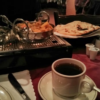 Restaurant Ganges - Saag paneer, Aloo gobi on a candle heated platter, with Naan and Spiced tea - Indian Near Me - Montreal, Quebec