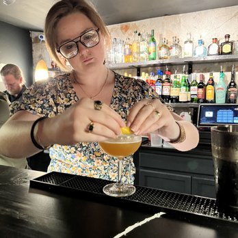 The Waiting Room - Bar area, friendly mixologist, tasty cocktail - Lounges Near Me - Durham, North Carolina
