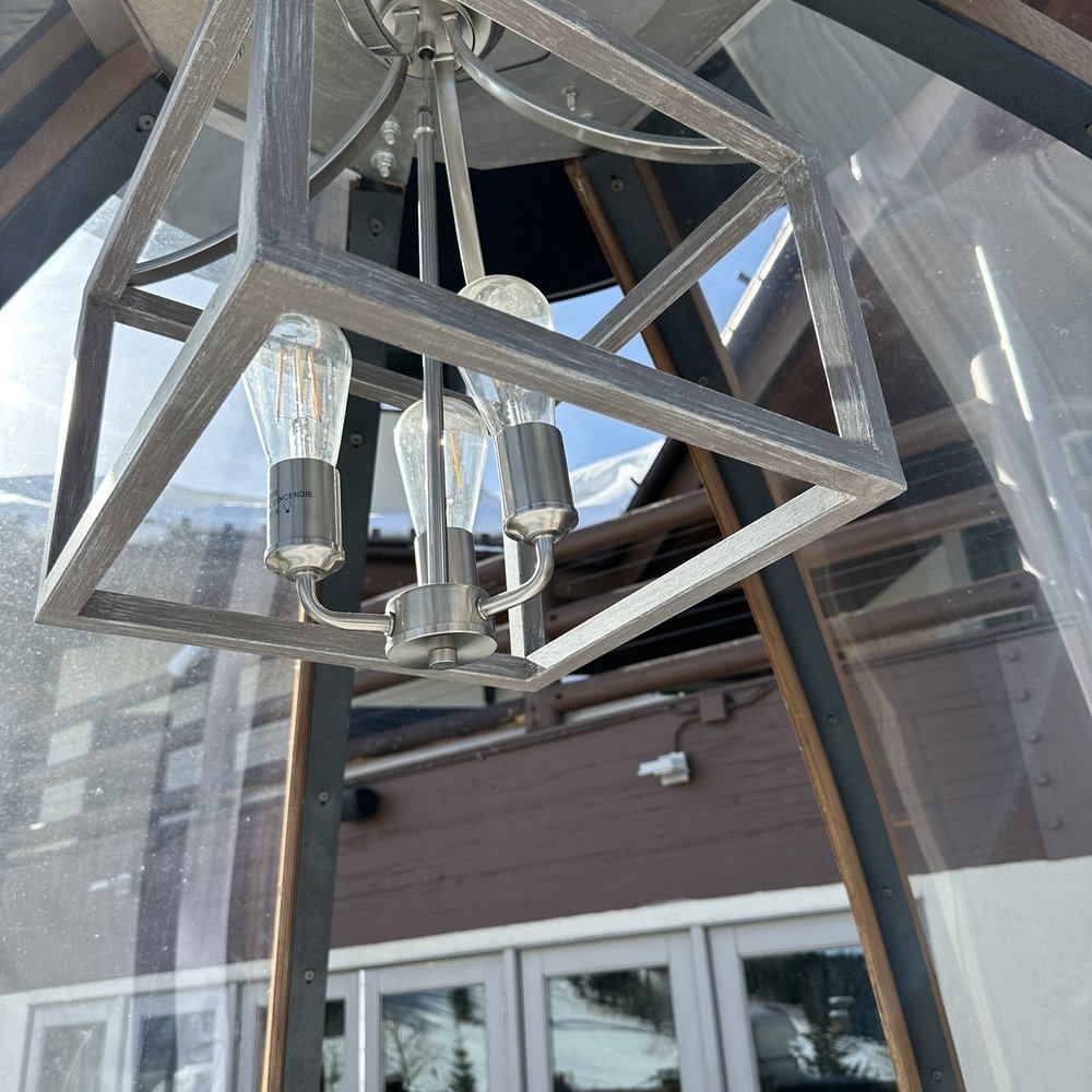 a light fixture hanging from the ceiling a light fixture hanging from the ceiling