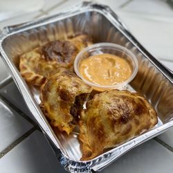 Super Empanada - Two beef, one chicken empanadas, 3 for $13. I can't recommend them more.