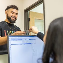 Riviera Family Dentistry - Front desk team assisting patients with check-in and insurance, ensuring a smooth visit.