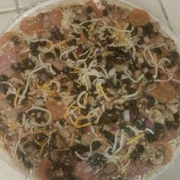 a pizza covered in plastic wrap a pizza covered in plastic wrap