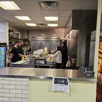 The Laughing Bull - The Laughing Bull Restaurant's kitchen with the owner/chefs and some of its employees. - Asian Fusion Near Me - Roanoke, Virginia