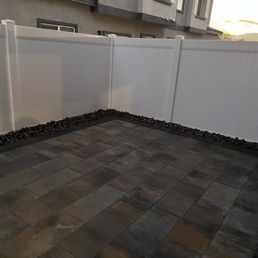 Victorian pavers with graphite boarder and river rock.  Next comes the plants and furniture!