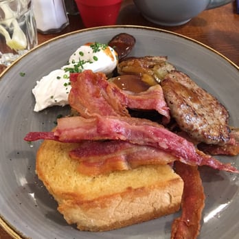 Alabama's All American Eatery - Poached eggs,bacon, sausage, home fries and Texas toast - yum - New American Near Me - Manchester, XGM