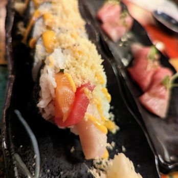 Iza Whiskey & Eats - Iza Crunch Raw Specialty Roll. $14. Cucumber, tuna, salmon, yellowtail, shiso, spicy mayo, tempura crunch. - Sushi Bars Near Me - Carrboro, North Carolina