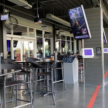 Topgolf - High chairs. - New American Near Me - Tampa, Florida Topgolf - High chairs. - New American Near Me - Tampa, Florida