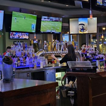 Hickory Tavern - the bar and televisions in the background - American Near Me - Cary, North Carolina
