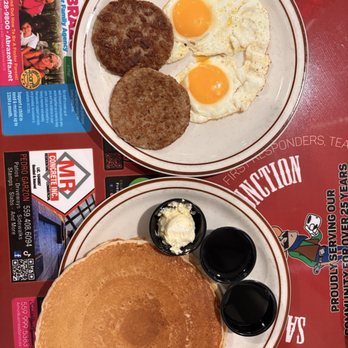 Sandy's Country Junction - Stack 'Em Up: two pancakes, sunny side up eggs, and sausage patties - Coffee & Tea Near Me - Clovis, California Sandy's Country Junction - Stack 'Em Up: two pancakes, sunny side up eggs, and sausage patties - Coffee & Tea Near Me - Clovis, California