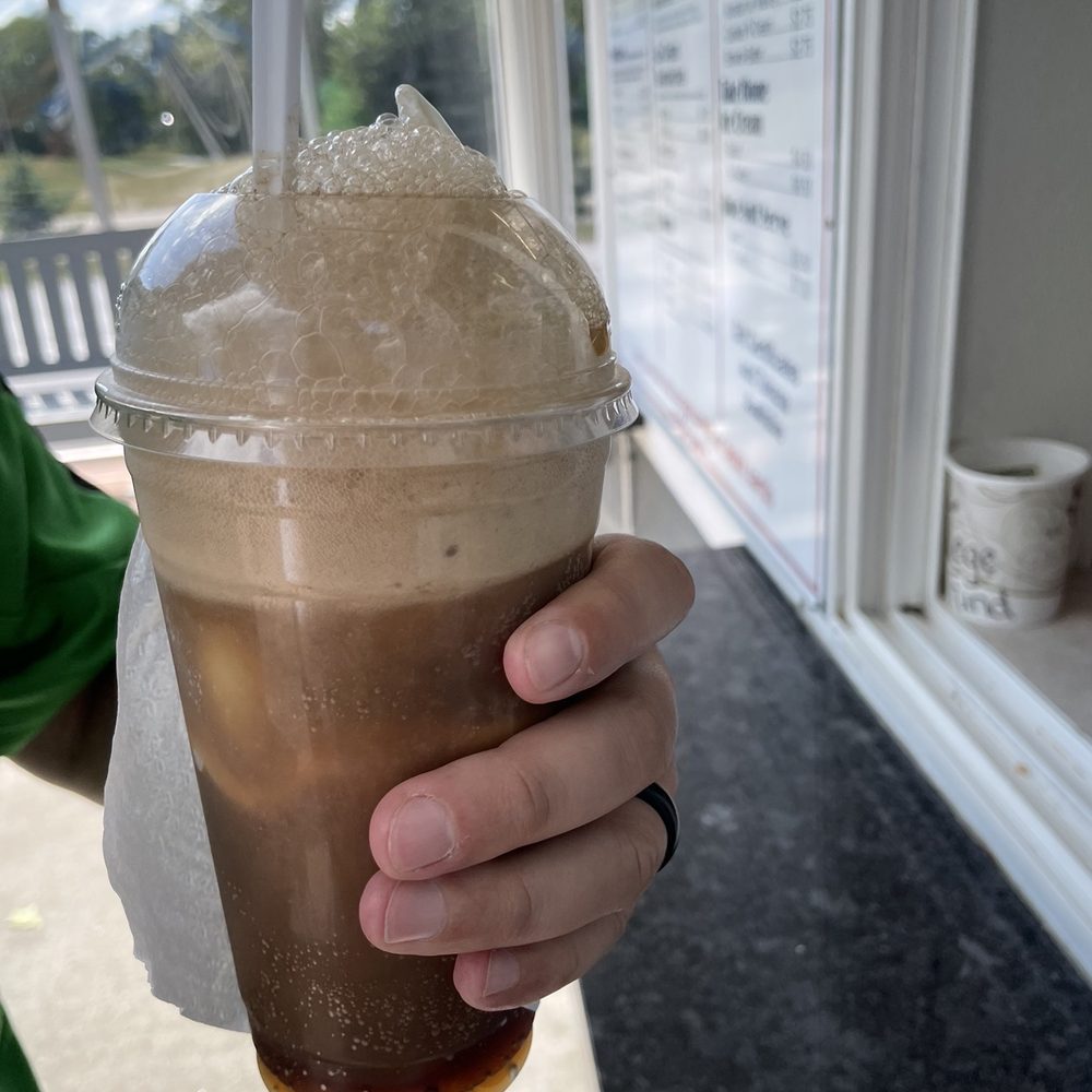 Cone Zone - a person holding a cup of iced coffee - Ice Cream & Frozen Yogurt Near Me - Milton, Wisconsin Cone Zone - a person holding a cup of iced coffee - Ice Cream & Frozen Yogurt Near Me - Milton, Wisconsin